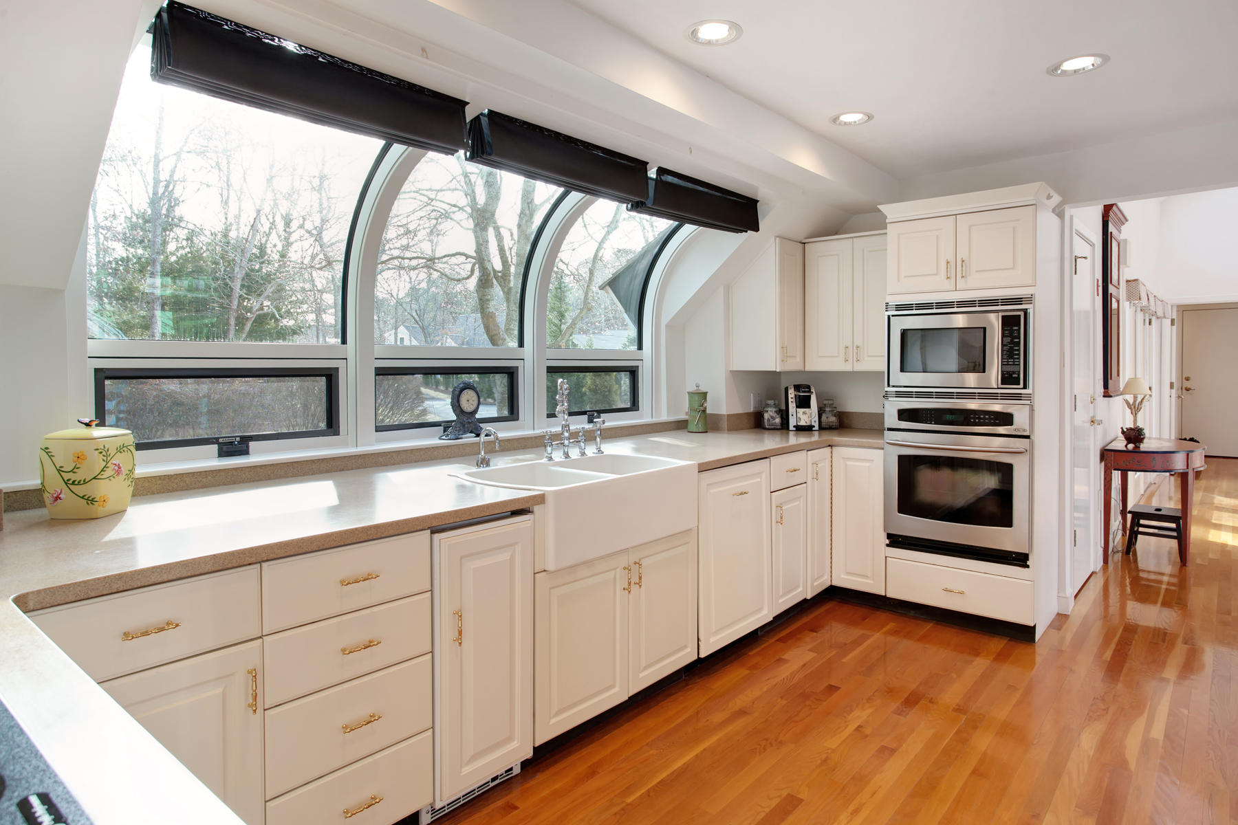 43 Tide Run Mashpee, MA 02649 - Photo 13 of 31 a kitchen with stainless steel appliances white cabinets a sink and a large window