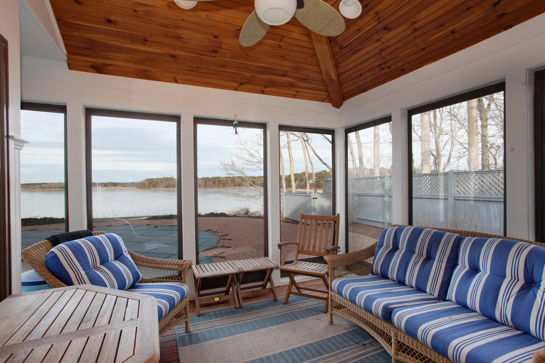 43 Tide Run Mashpee, MA 02649 - Photo 15 of 31 a living room with furniture a ceiling fan and a large window