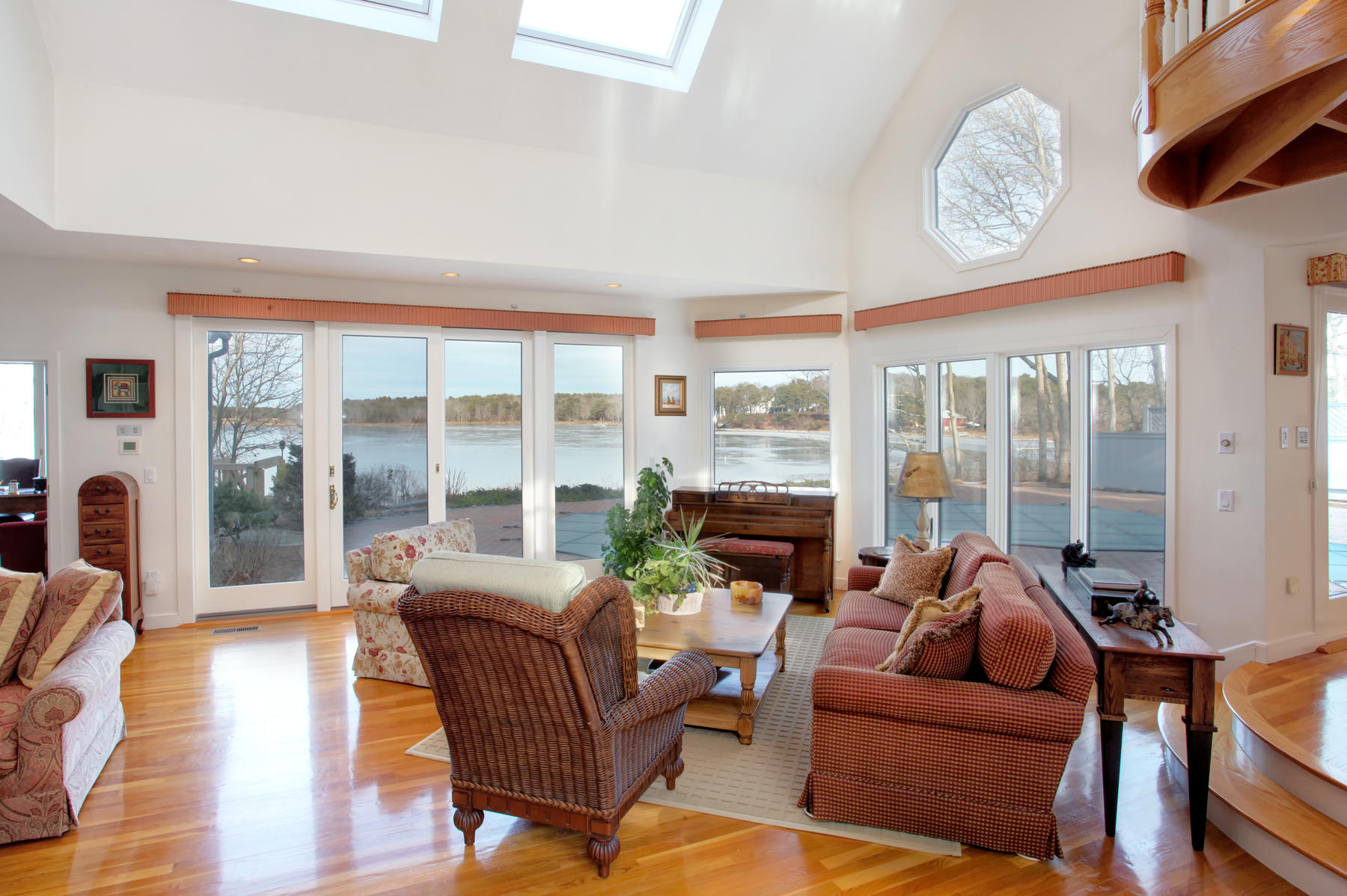 43 Tide Run Mashpee, MA 02649 - Photo 9 of 31 a living room with furniture large windows and wooden floor