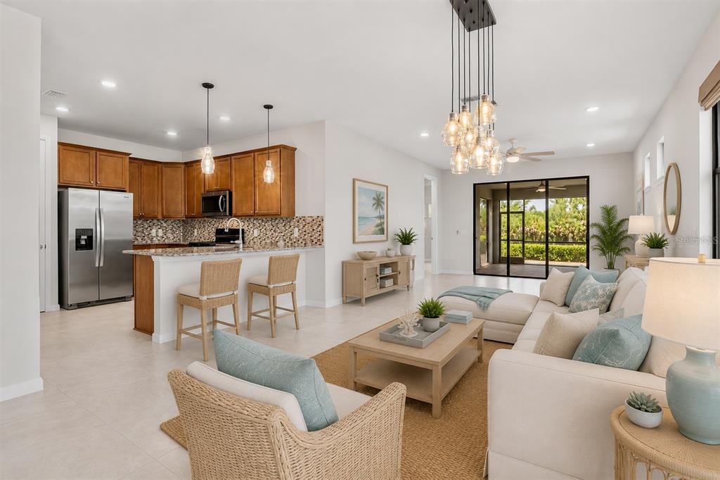 12276 Marsh Pointe Road Sarasota, FL 34238 - Photo 13 of 48 a living room with fireplace furniture and a chandelier