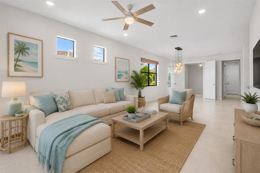 12276 Marsh Pointe Road Sarasota, FL 34238 - Photo 9 of 48 a living room with furniture and a wooden floor