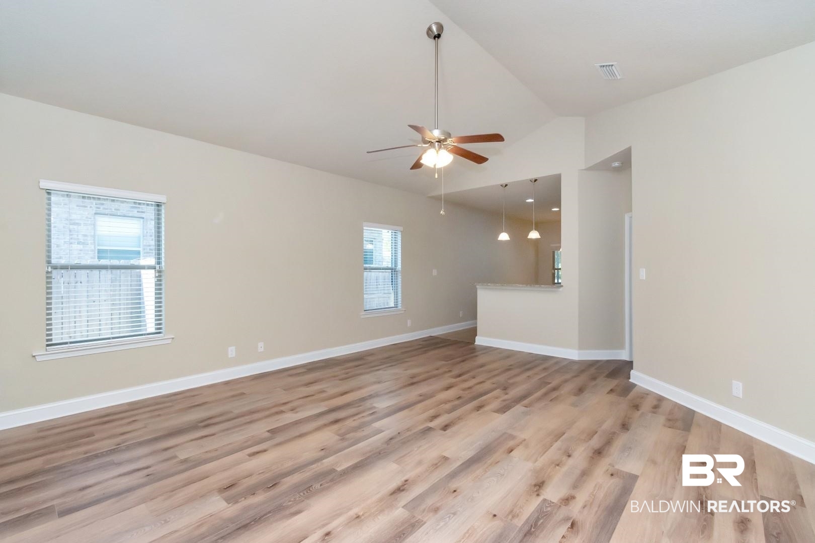 6144 Whitebark Drive Mobile, AL 36693 - Photo 3 of 33 Empty room with high vaulted ceiling, ceiling fan, light hardwood / wood-style floors, and a wealth of natural light
