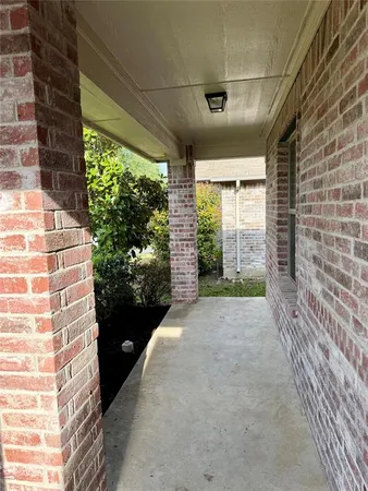 a view of entryway with a floor to ceiling window