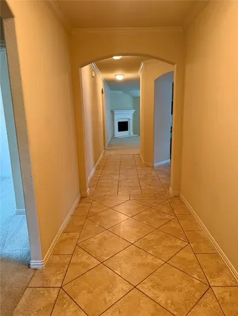 a view of hallway with wooden floor