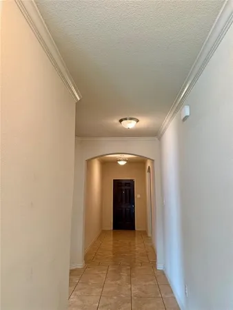 a view of a hallway with an entryway