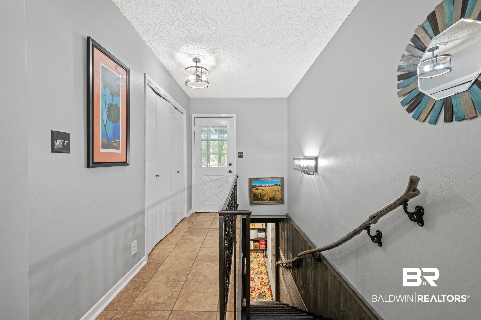 40 Caisson Trace Daphne, AL 36527 - Photo 10 of 54 Stairs featuring light tile patterned floors.