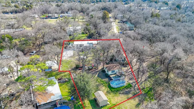 a view of a house with swimming pool and sitting area