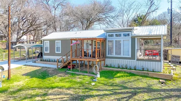 a view of house with outdoor seating
