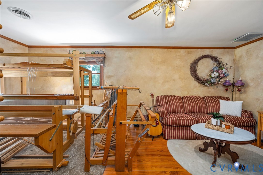 1801 Georgetown Road Heathsville, VA 22473 - Photo 68 of 83 Warm-toned walls complement wood-finish flooring