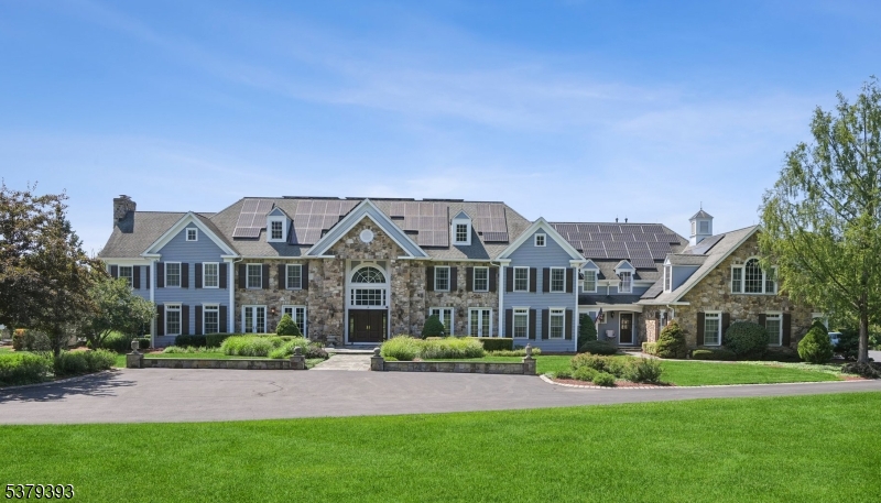 a front view of a house with a garden and plants