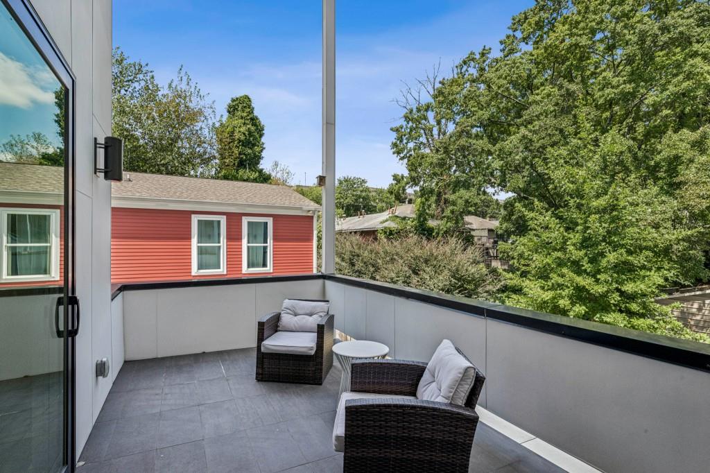536 Highland Avenue Northeast, Unit A Atlanta, GA 30312 - Photo 19 of 51 a view of balcony with couple of couch
