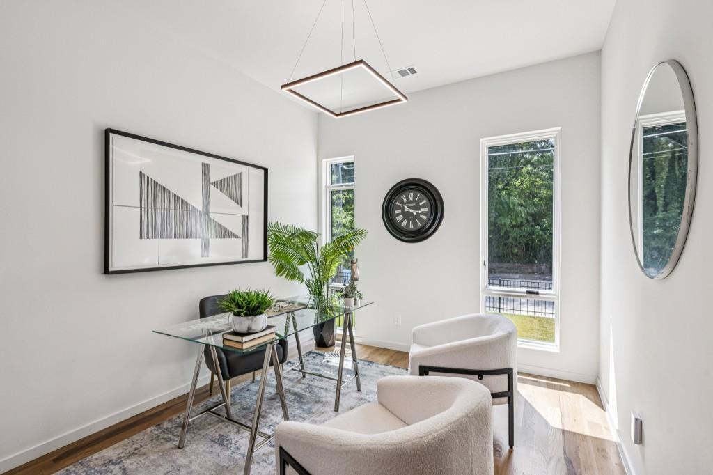536 Highland Avenue Northeast, Unit A Atlanta, GA 30312 - Photo 21 of 51 a living room with furniture and a mirror