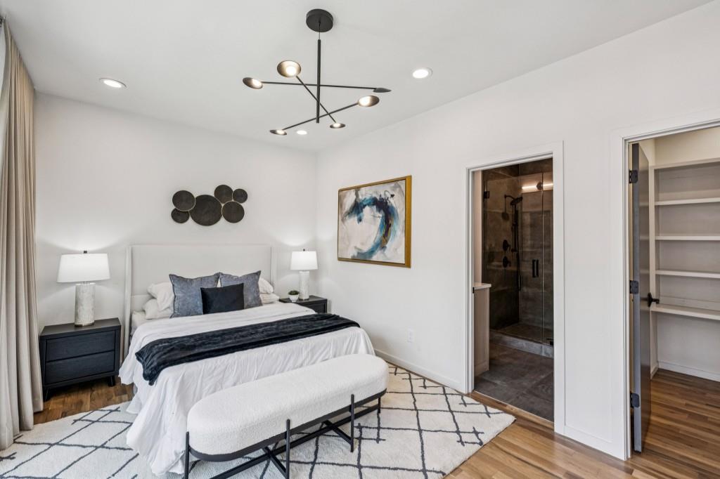 536 Highland Avenue Northeast, Unit A Atlanta, GA 30312 - Photo 23 of 51 a bedroom with a bed and a view of bathroom