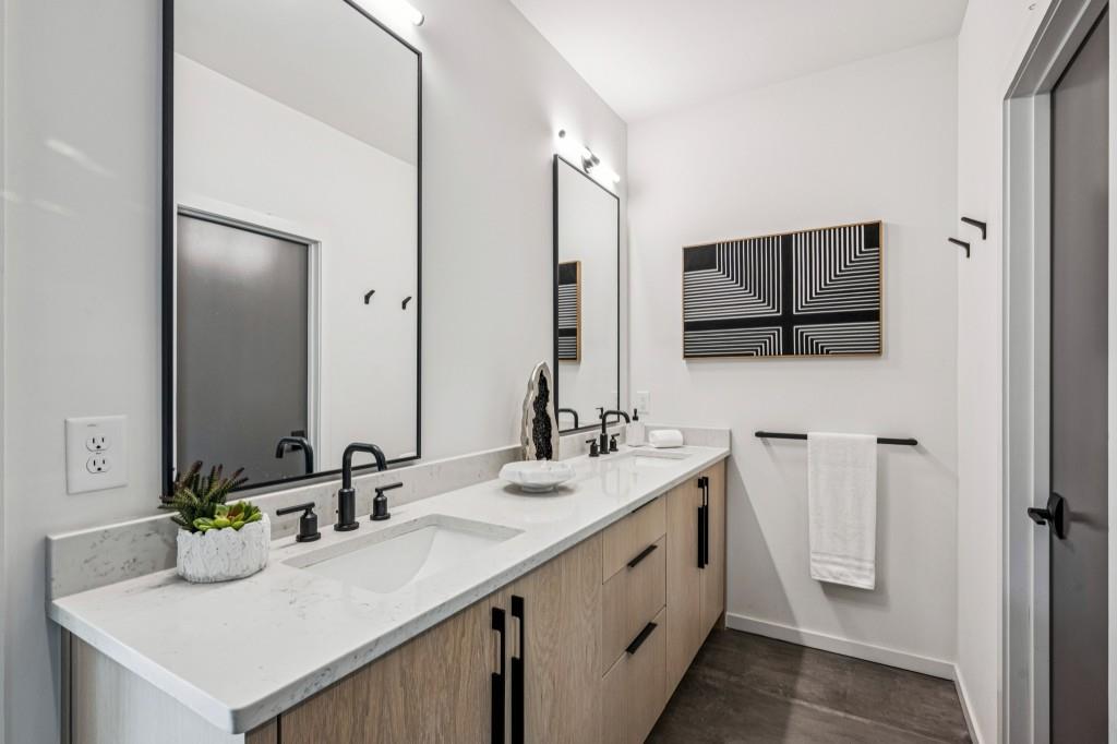 536 Highland Avenue Northeast, Unit A Atlanta, GA 30312 - Photo 25 of 51 a bathroom with a sink double vanity and a mirror