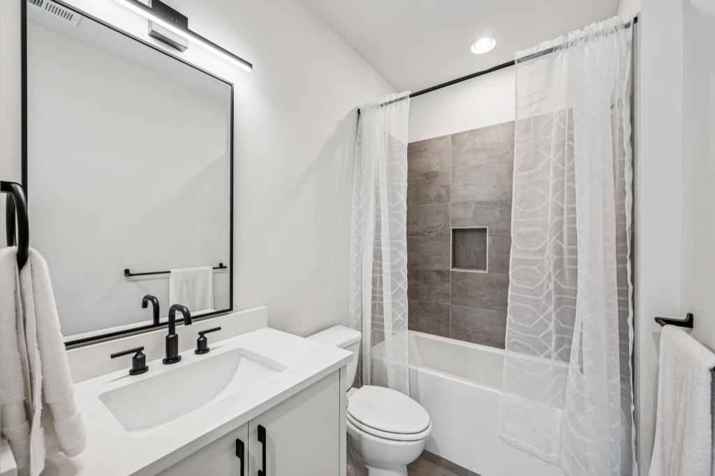 536 Highland Avenue Northeast, Unit A Atlanta, GA 30312 - Photo 27 of 51 a bathroom with a sink toilet and shower