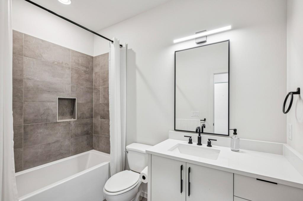 536 Highland Avenue Northeast, Unit A Atlanta, GA 30312 - Photo 29 of 51 a bathroom with a sink and a mirror