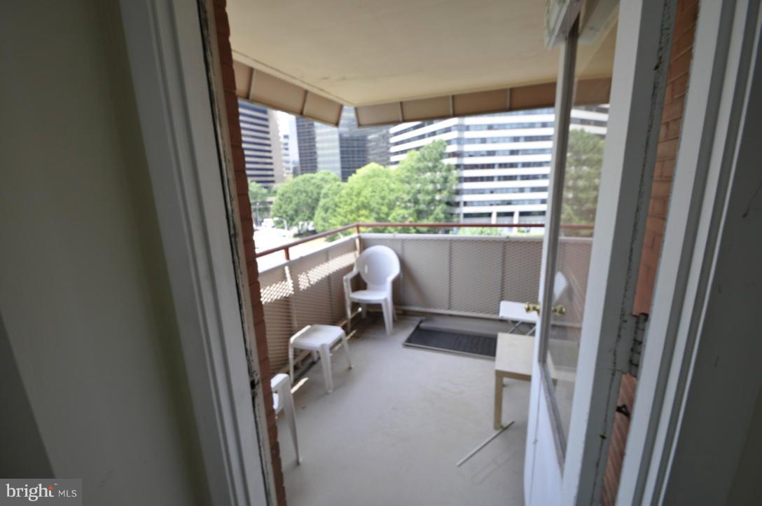 1121 Arlington Boulevard, Unit 842 Arlington, VA 22209 - Photo 14 of 30 a view of a house with a porch and furniture