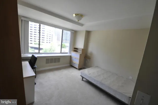 a view of room with window and furniture