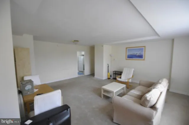 a bedroom with a bed chair and a window