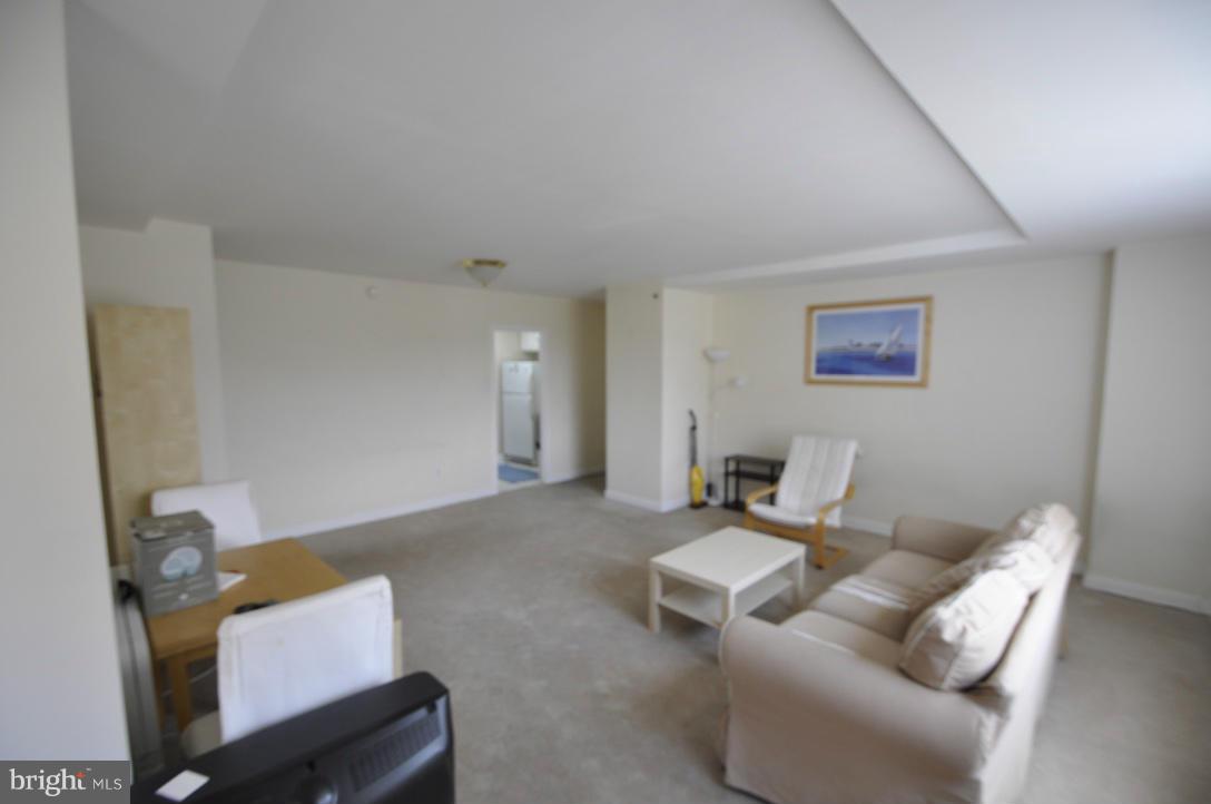 1121 Arlington Boulevard, Unit 842 Arlington, VA 22209 - Photo 18 of 30 a living room with furniture and a window