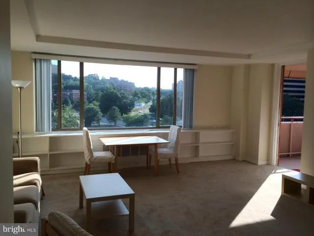 a room with furniture and a window