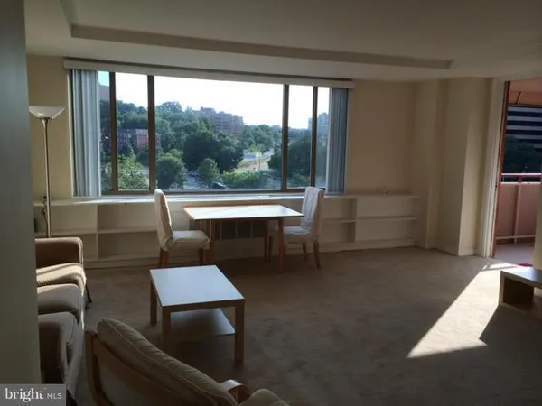 a workspace with furniture and a window