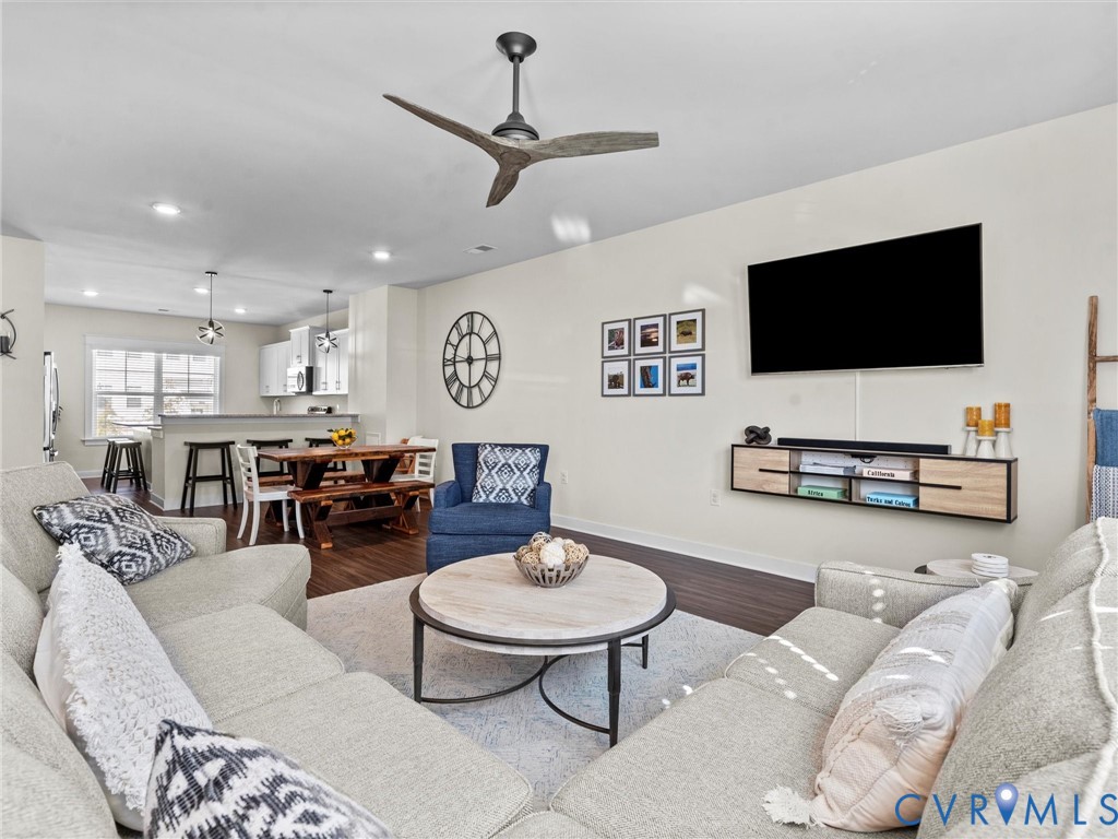 12320 Petrel Crossing Midlothian, VA 23112 - Photo 12 of 34 a living room with furniture kitchen view and a flat screen tv