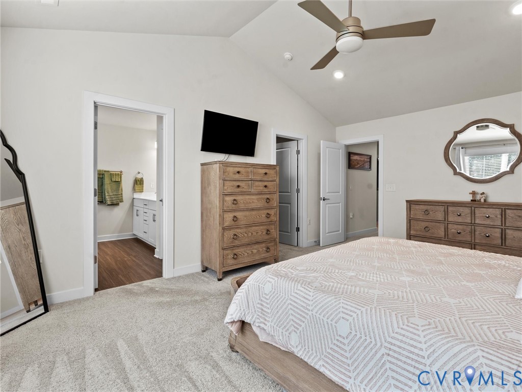 12320 Petrel Crossing Midlothian, VA 23112 - Photo 17 of 34 a bedroom with a bed and a flat screen tv