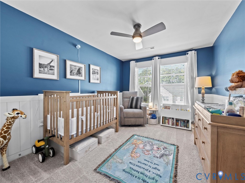12320 Petrel Crossing Midlothian, VA 23112 - Photo 24 of 34 a bedroom with furniture and a window
