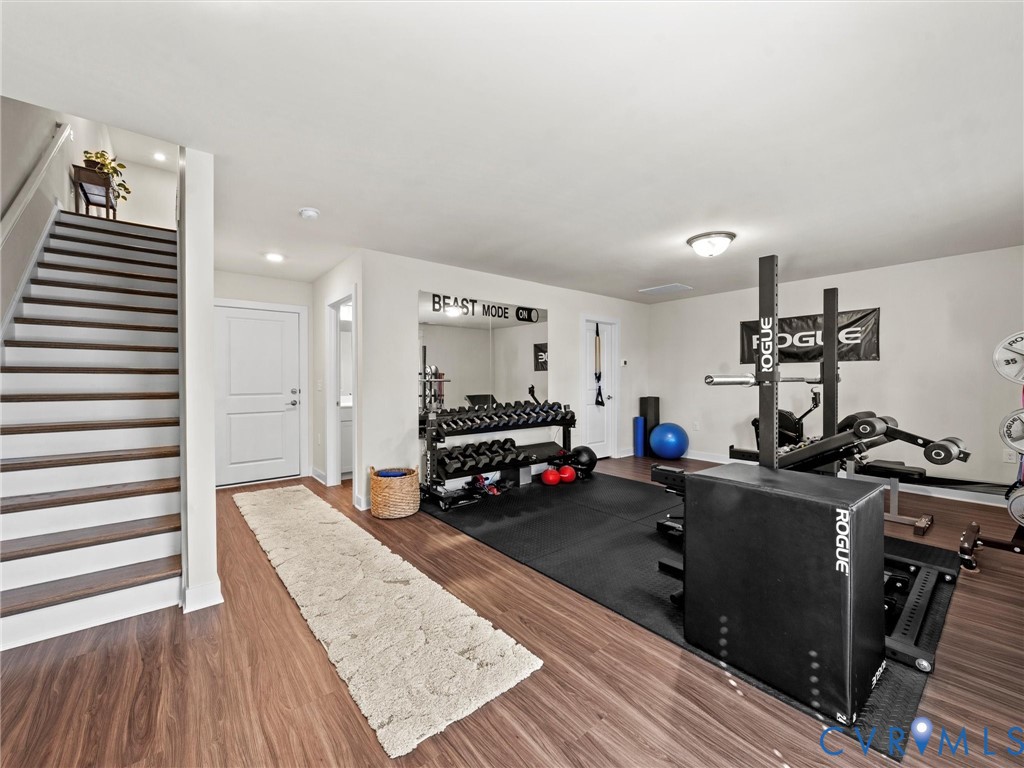 12320 Petrel Crossing Midlothian, VA 23112 - Photo 27 of 34 a living room with furniture and a wooden floor