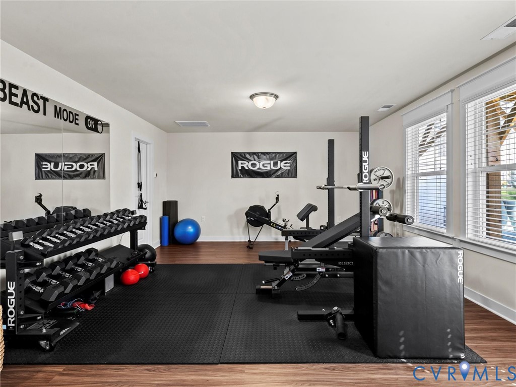 12320 Petrel Crossing Midlothian, VA 23112 - Photo 30 of 34 a living room with furniture a computer and a window