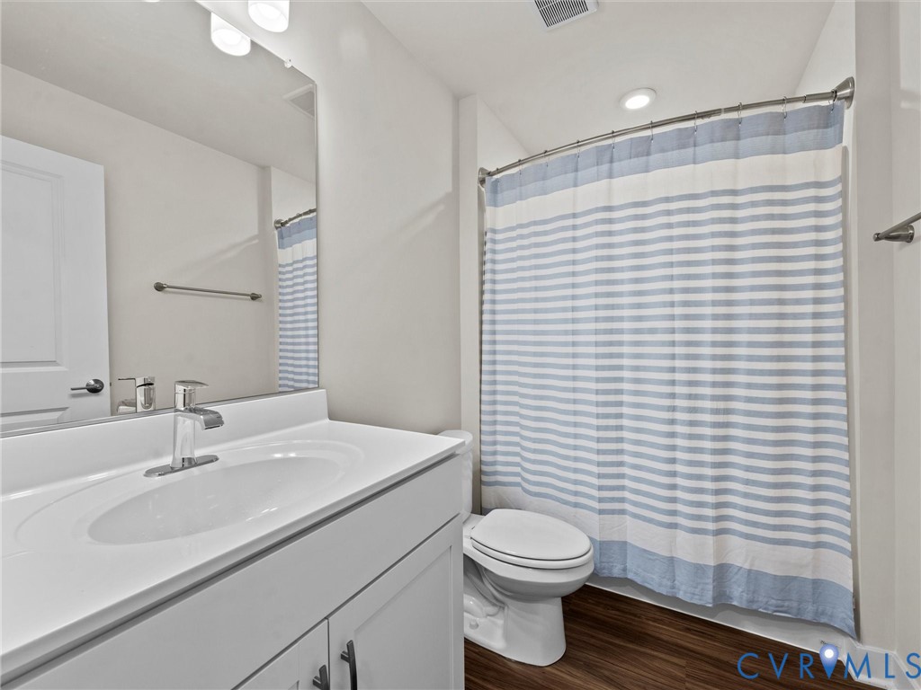 12320 Petrel Crossing Midlothian, VA 23112 - Photo 31 of 34 a bathroom with a sink a toilet and shower