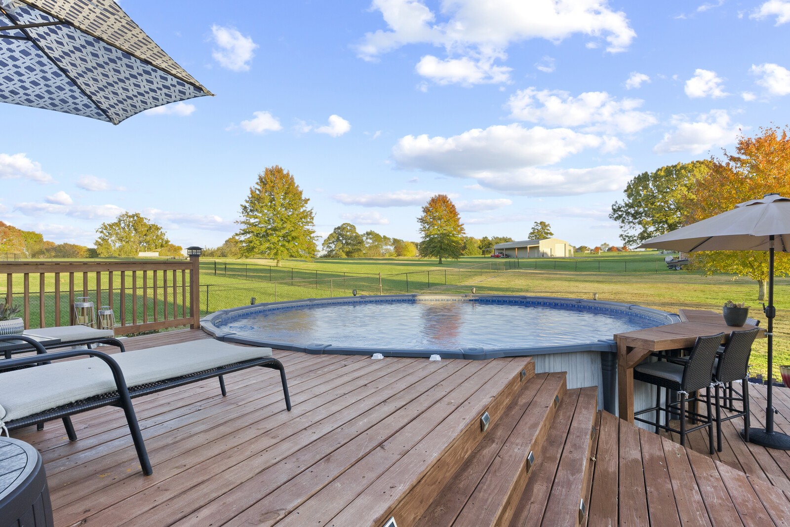 101 Brandy Hollow Road Portland, TN 37148 - Photo 42 of 50 a view of a chairs and table on the wooden deck