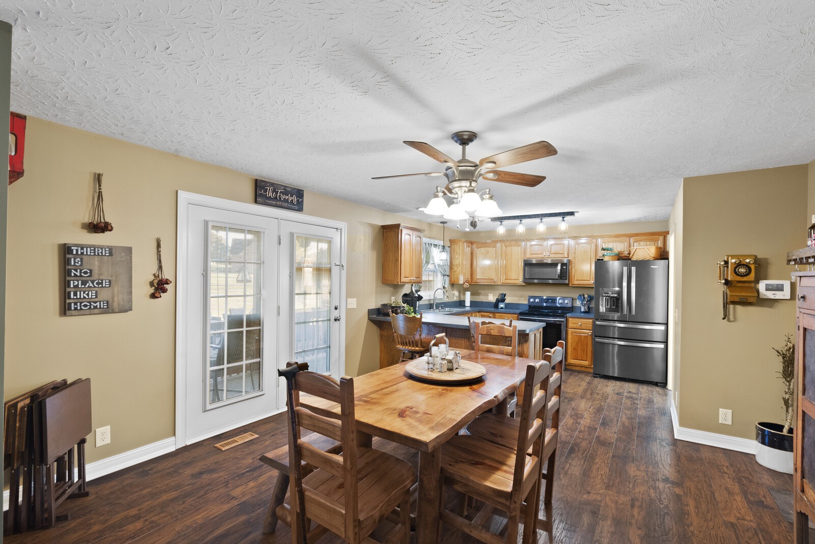 101 Brandy Hollow Road Portland, TN 37148 - Photo 8 of 50 a view of a dining room with furniture a kitchen and chandelier