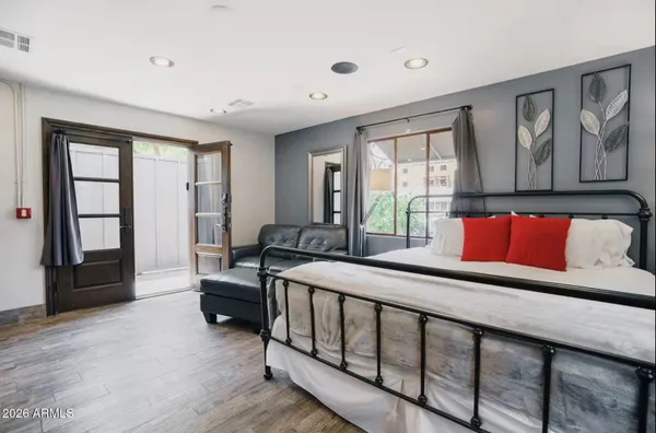 a bedroom with furniture and windows