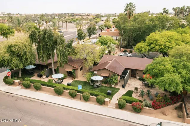 an aerial view of house with yard