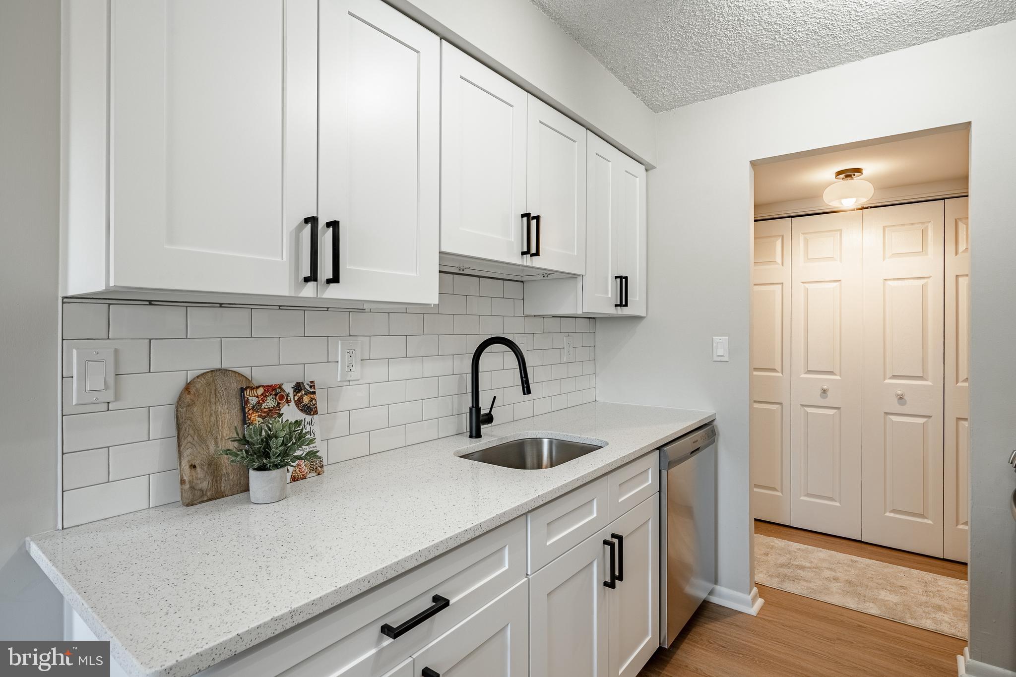2714 Eagle Road, Unit 2714 West Chester, PA 19382 - Photo 11 of 25 a kitchen with stainless steel appliances granite countertop white cabinets and a granite counter tops