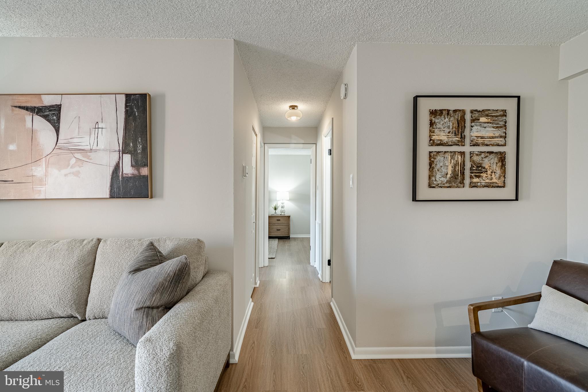 2714 Eagle Road, Unit 2714 West Chester, PA 19382 - Photo 13 of 25 a living room with furniture and a mirror