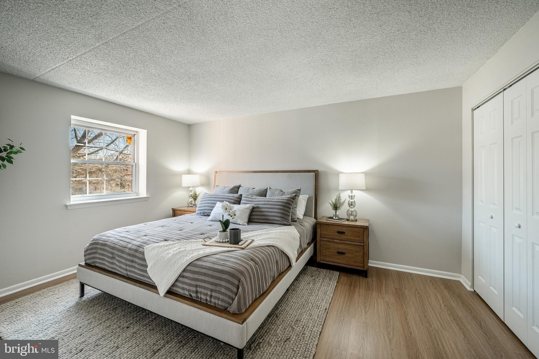 2714 Eagle Road, Unit 2714 West Chester, PA 19382 - Photo 14 of 25 a bedroom with a bed and a window