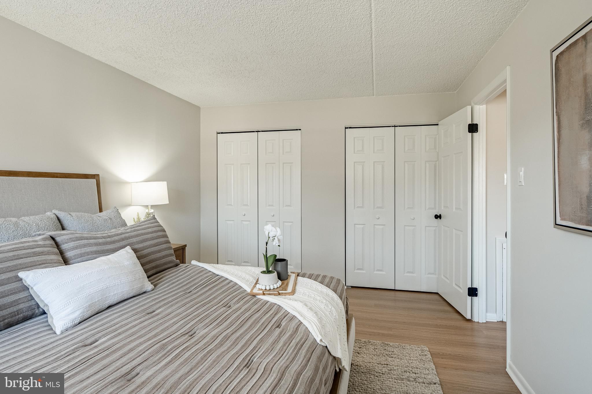 2714 Eagle Road, Unit 2714 West Chester, PA 19382 - Photo 16 of 25 a bedroom with a bed and a night stand