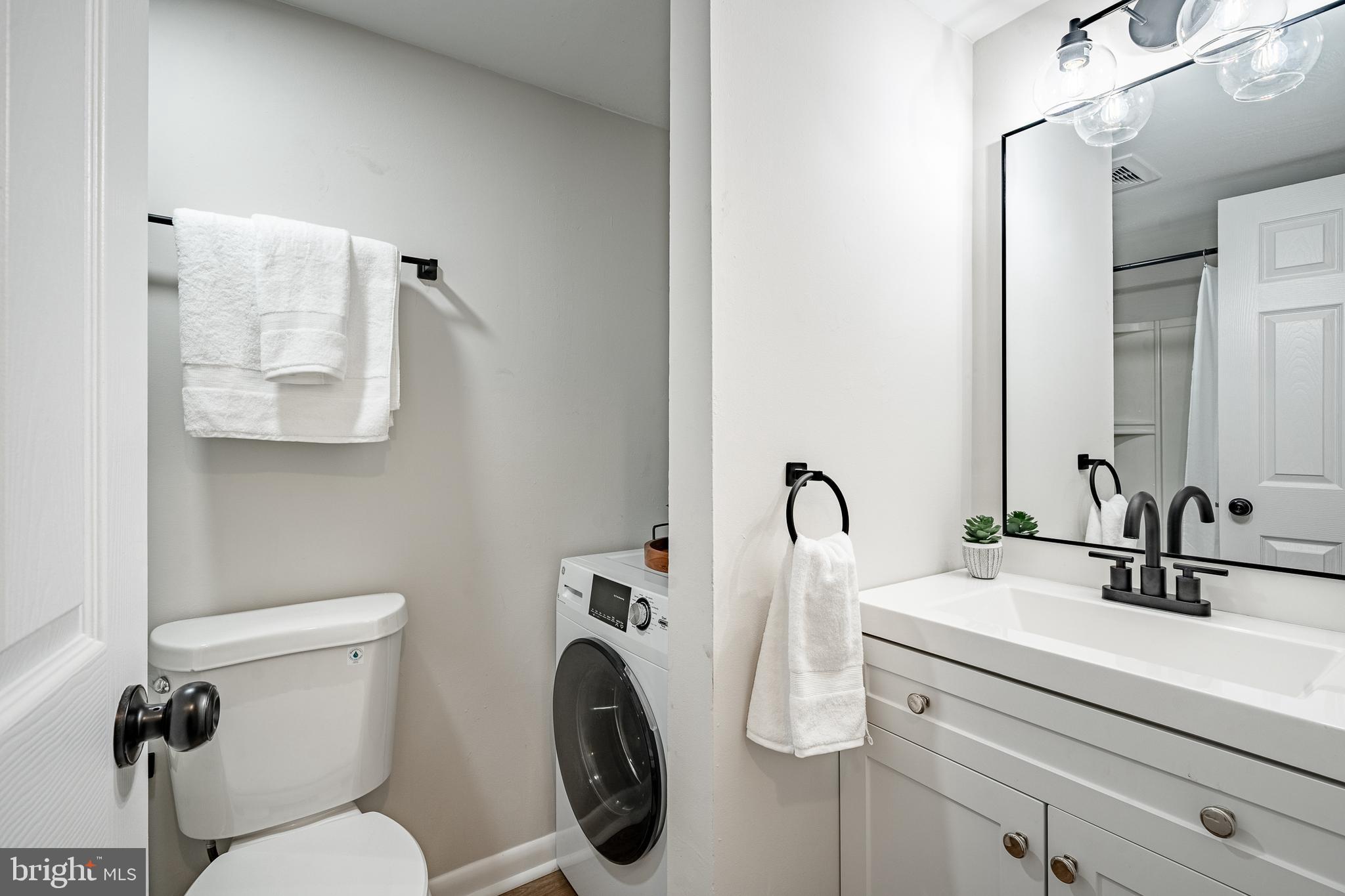 2714 Eagle Road, Unit 2714 West Chester, PA 19382 - Photo 17 of 25 a bathroom with a toilet sink and mirror