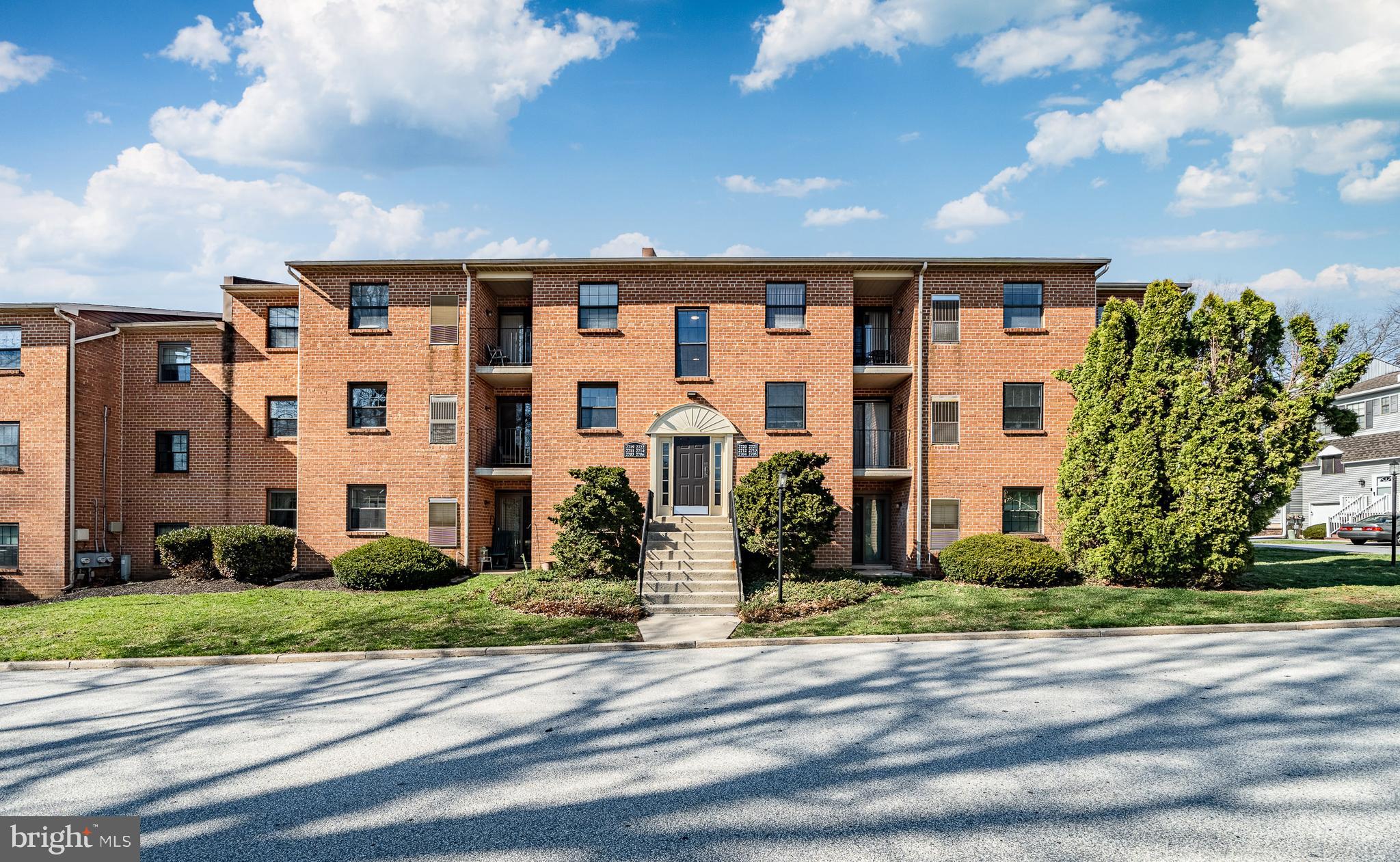 2714 Eagle Road, Unit 2714 West Chester, PA 19382 - Photo 2 of 25 a front view of a building with a garden