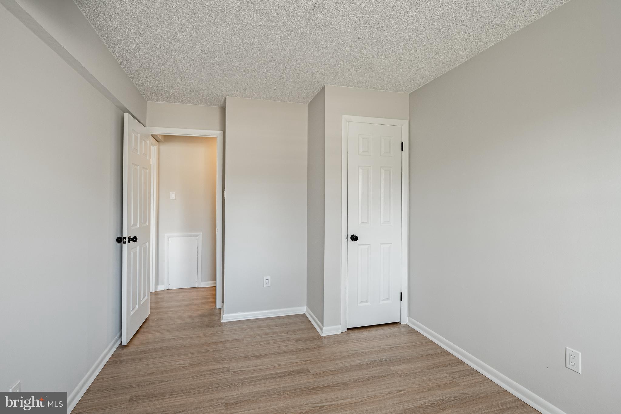 2714 Eagle Road, Unit 2714 West Chester, PA 19382 - Photo 21 of 25 a view of an empty room and wooden floor