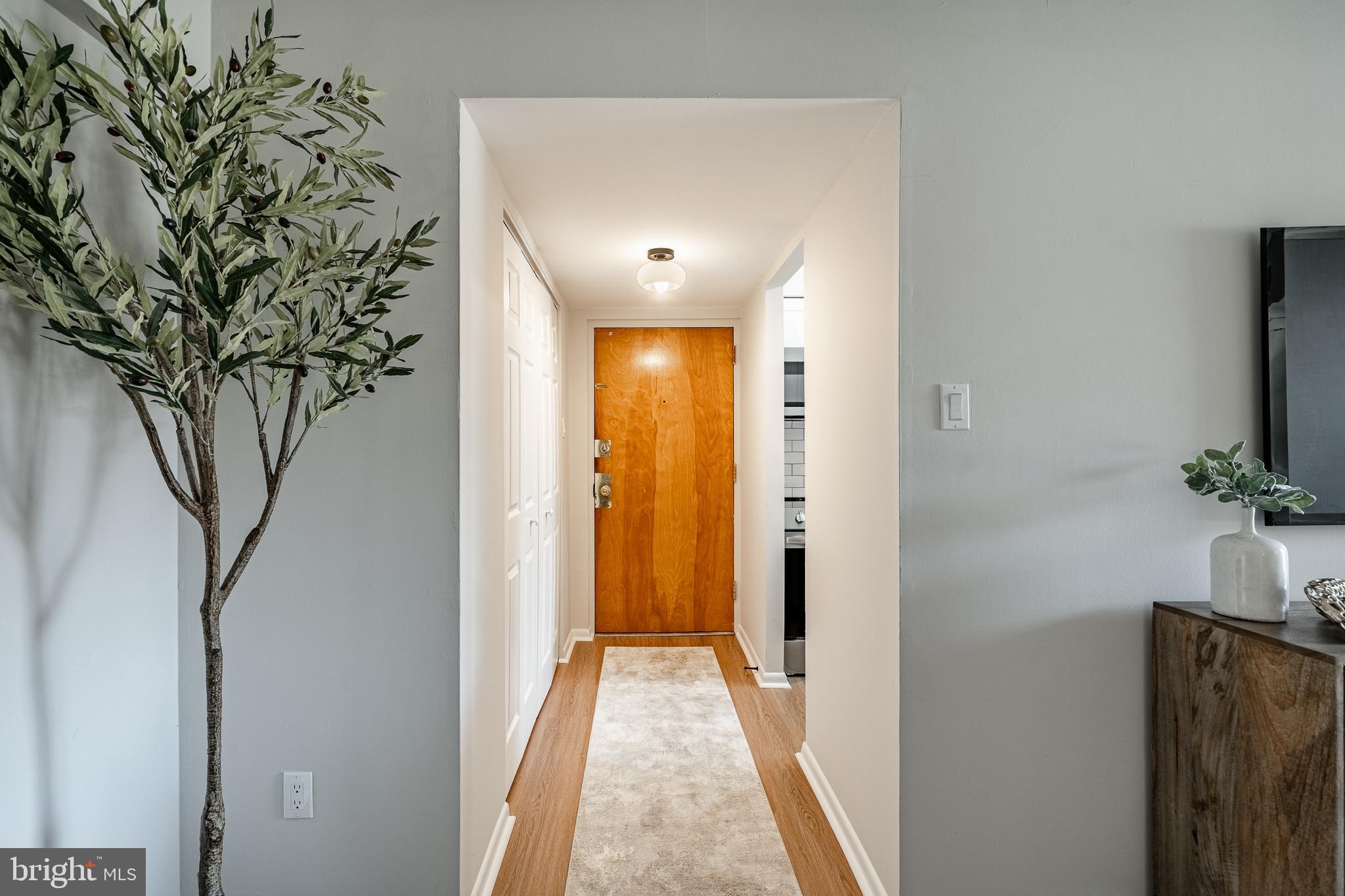 2714 Eagle Road, Unit 2714 West Chester, PA 19382 - Photo 3 of 25 a view of a hallway with a flat screen tv