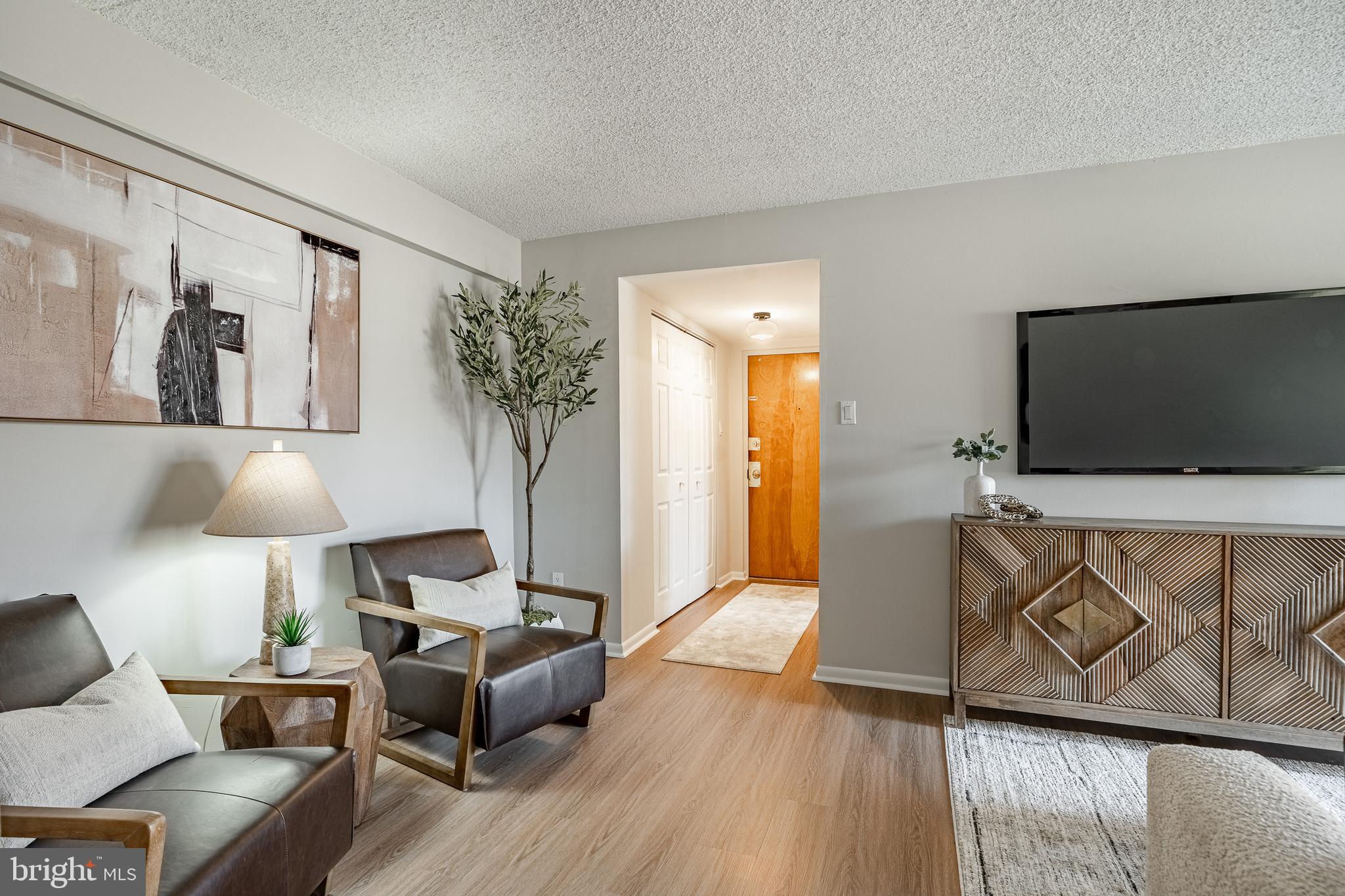 2714 Eagle Road, Unit 2714 West Chester, PA 19382 - Photo 4 of 25 a living room with furniture and a flat screen tv
