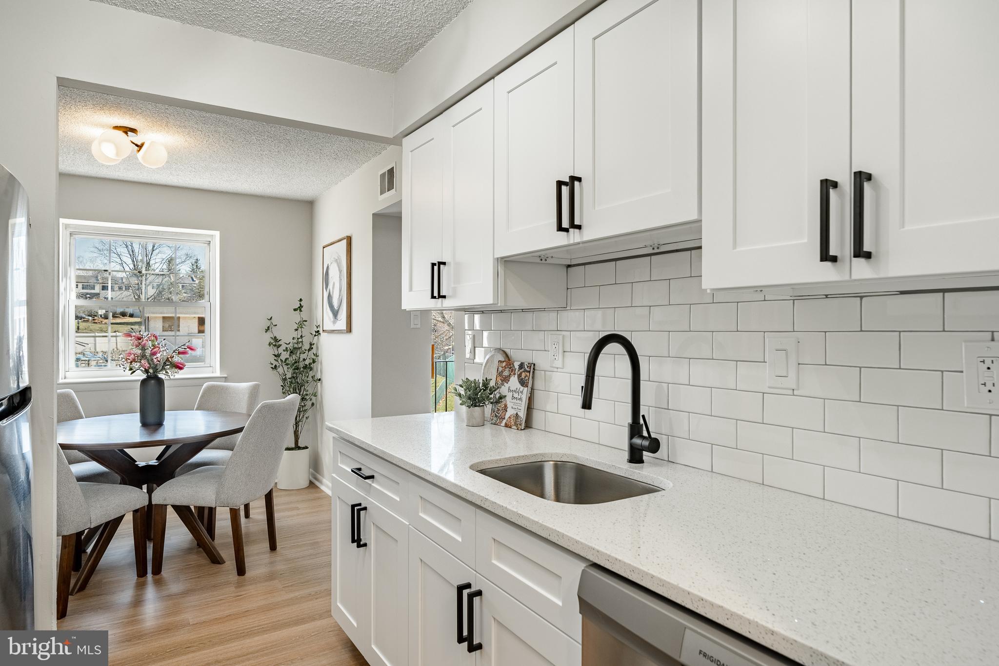 2714 Eagle Road, Unit 2714 West Chester, PA 19382 - Photo 9 of 25 a kitchen with stainless steel appliances a sink and cabinets