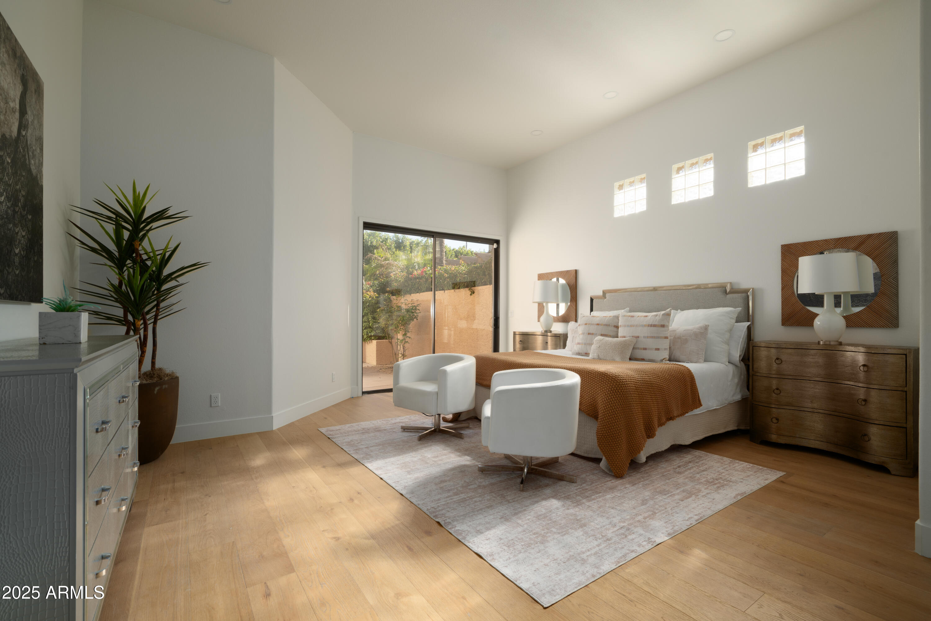 8100 East Camelback Road, Unit 175 Scottsdale, AZ 85251 - Photo 13 of 25 a bed room with a bed and a couch