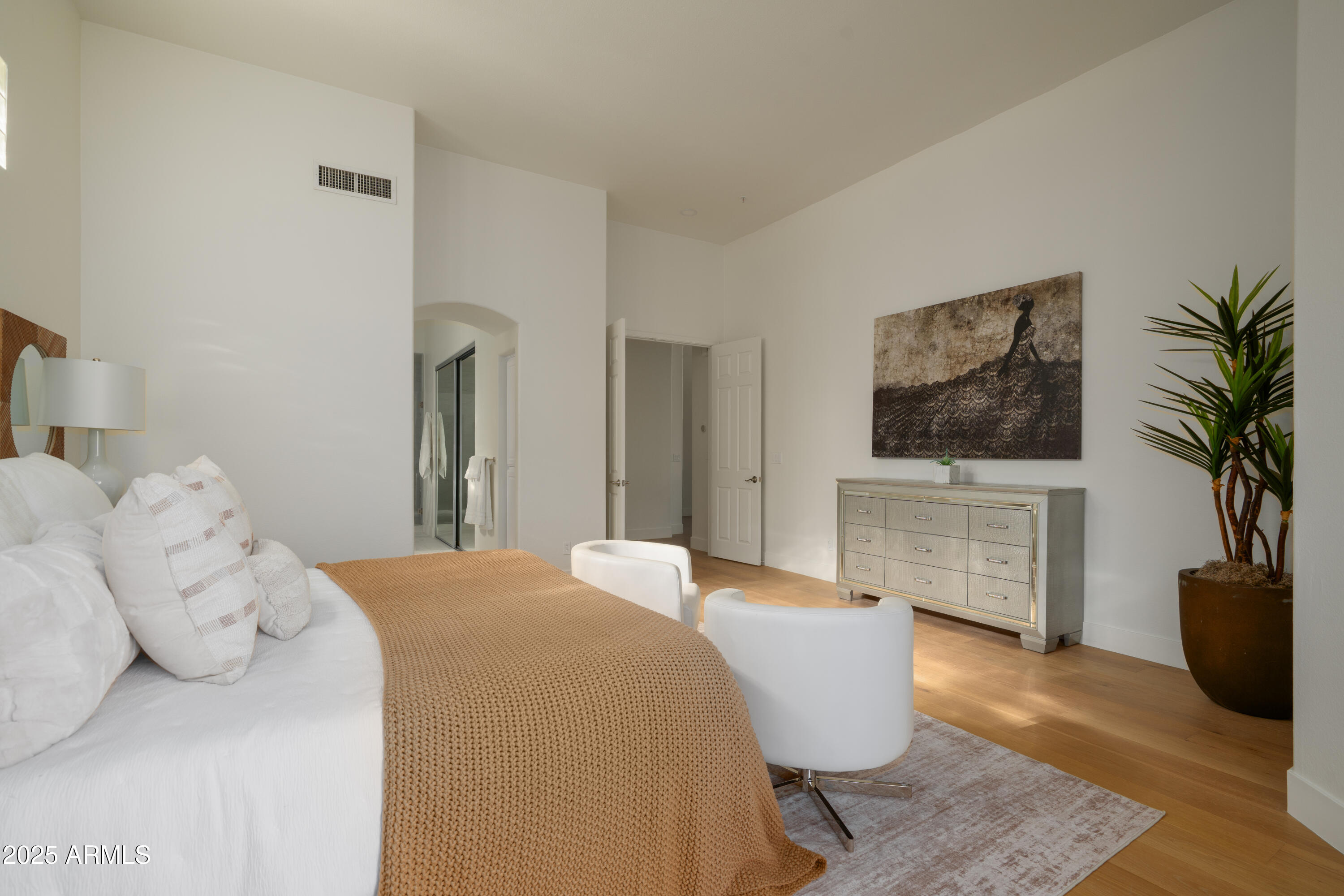 8100 East Camelback Road, Unit 175 Scottsdale, AZ 85251 - Photo 15 of 25 a bedroom with a bed and a television