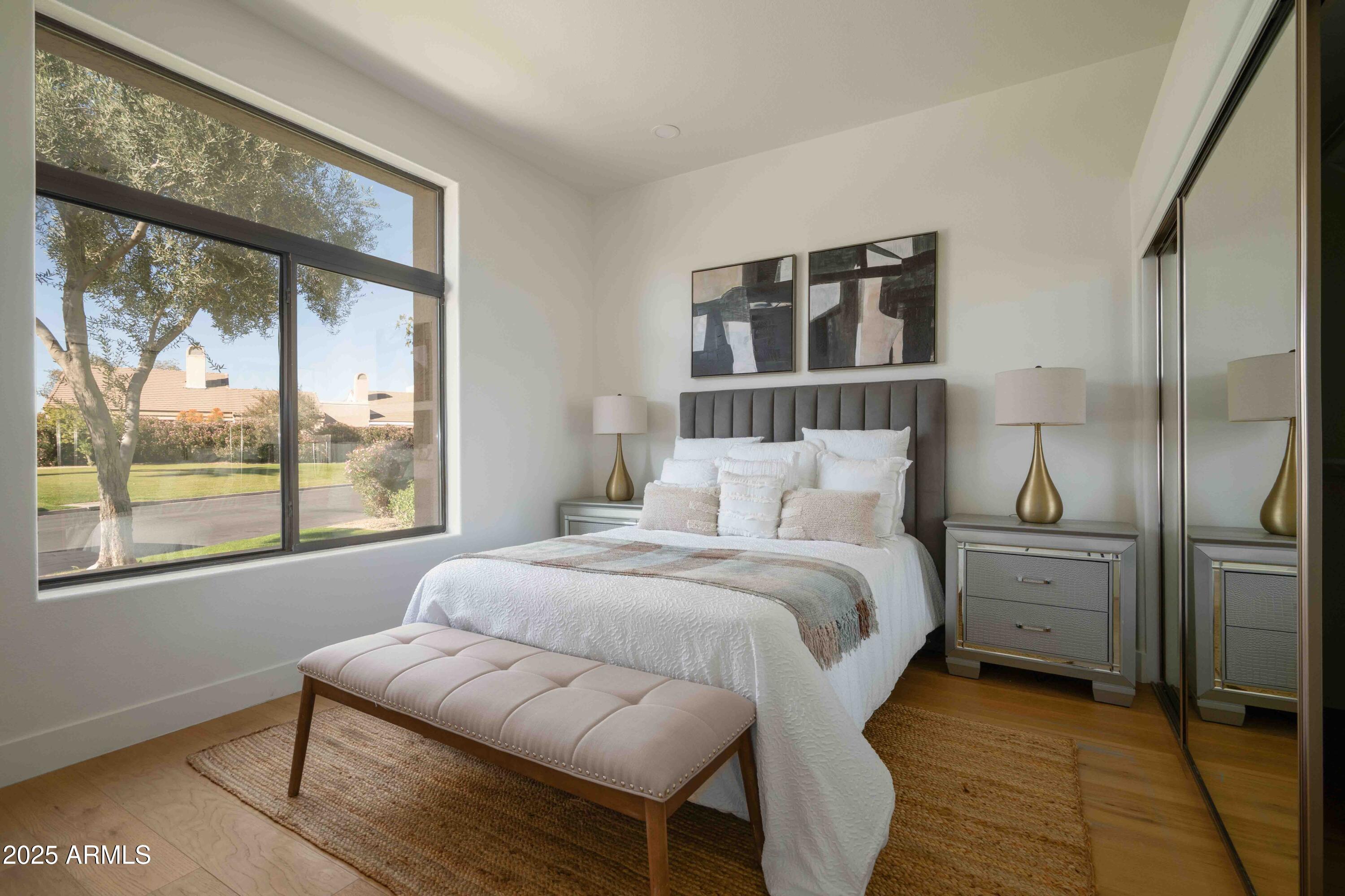 8100 East Camelback Road, Unit 175 Scottsdale, AZ 85251 - Photo 21 of 25 a bedroom with a bed and a large window