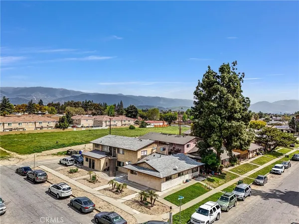 an aerial view of a house with outdoor space